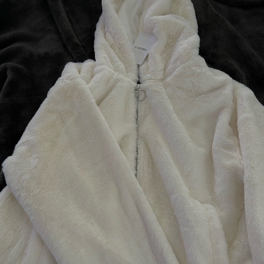 Outside white puffy jacket. Brand new with tags